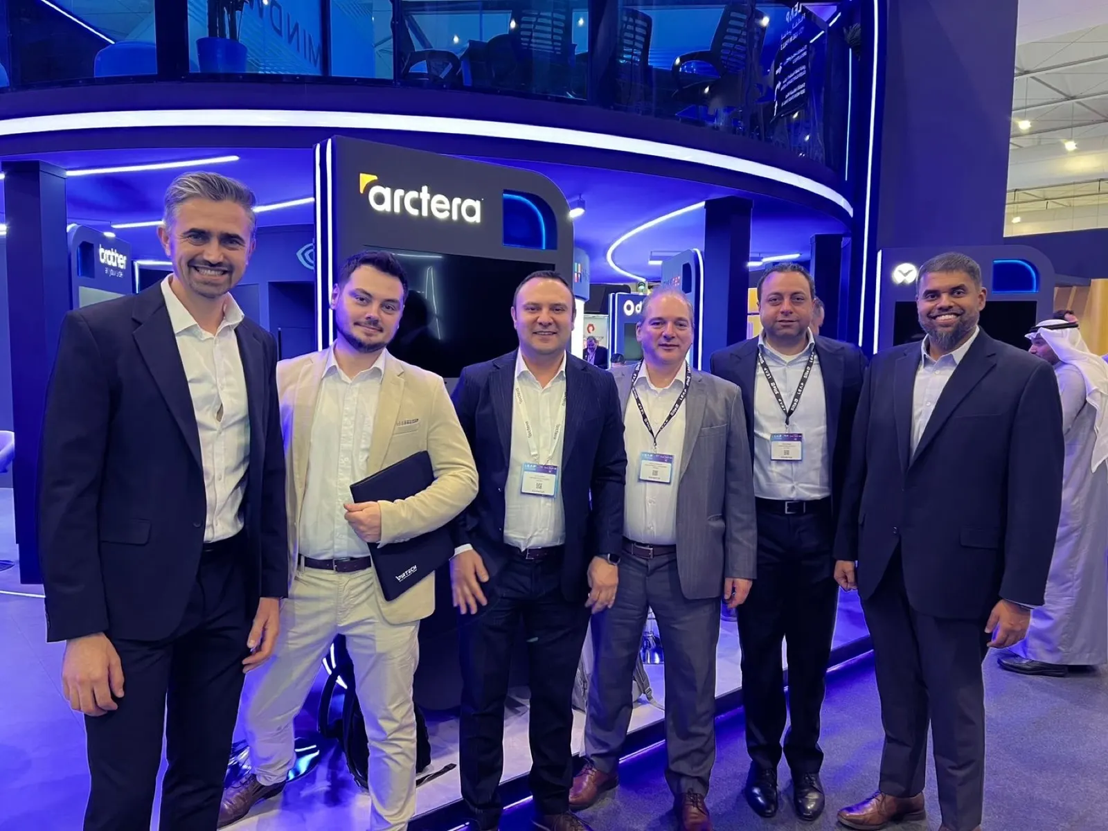 Virgil Dobos and Lucian Isaia of Virtech with the Arctera team at the Arctera stand, LEAP 2025 Riyadh